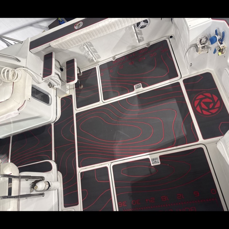 Freshly installed custom marine decking in a center console cockpit