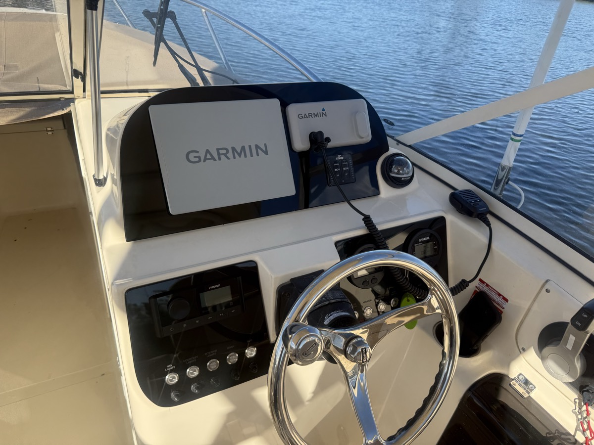 Rebuilt helm with twin Garmin displays set into a custom dash panel