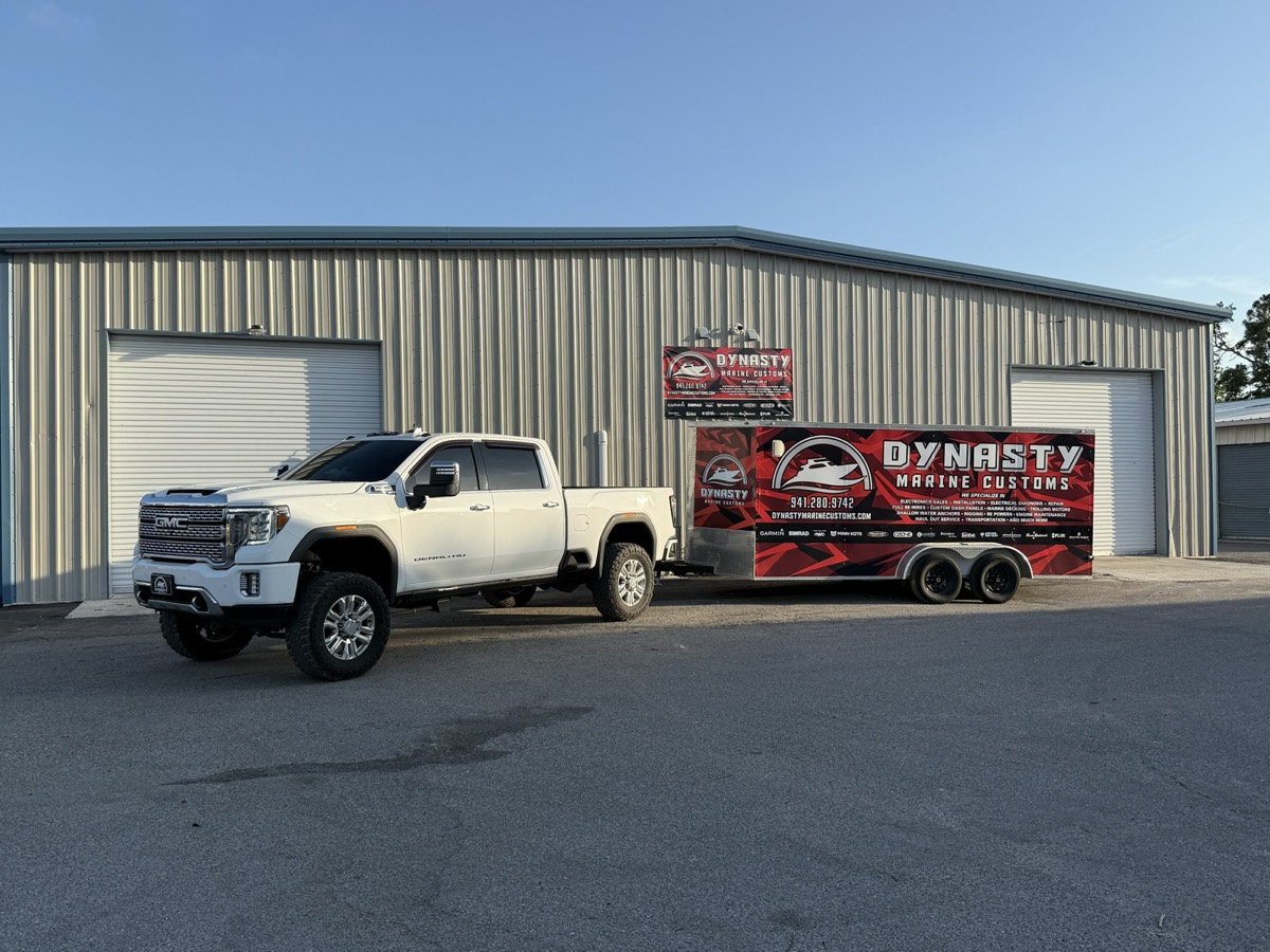 Dynasty Marine Customs branded truck and trailer outside the Sarasota shop